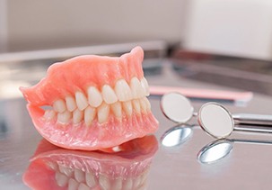 a full denture on a metal tray